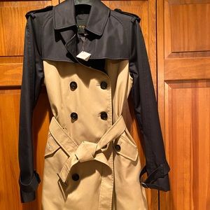 Women’s Coach trench coat. Black and Tan never worn.